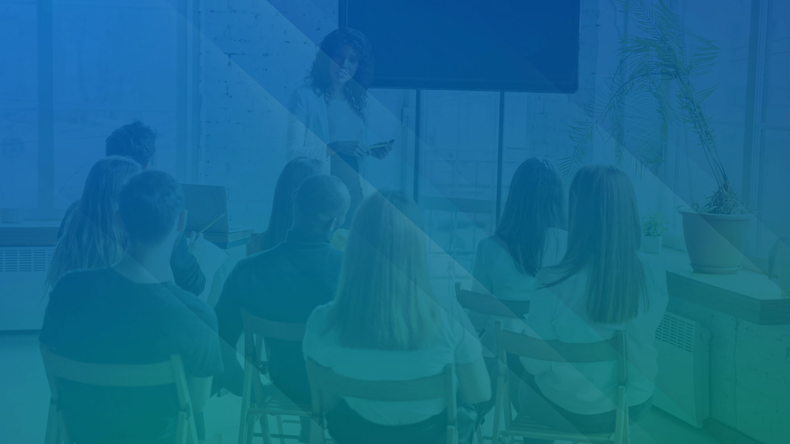 Female african-american speaker giving presentation in hall at university workshop